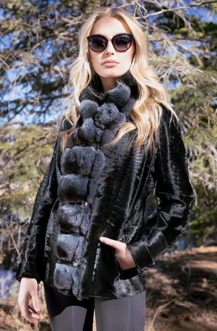 woman with her hand in her pocket Russian Broadtail Reversible to Shearling with Dyed Chinchilla Tuxedo collar