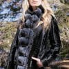 woman with her hand in her pocket Russian Broadtail Reversible to Shearling with Dyed Chinchilla Tuxedo collar