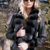 woman wearing sunglasses and Russian Broadtail Reversible to Shearling with Dyed Chinchilla Tuxedo collar