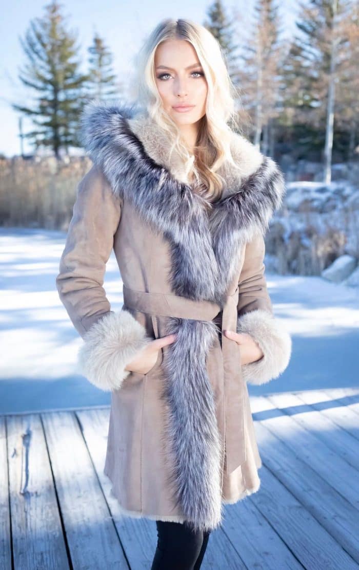 Merino Shearling with Silver Fox on a woman with her hands in her pocket outside