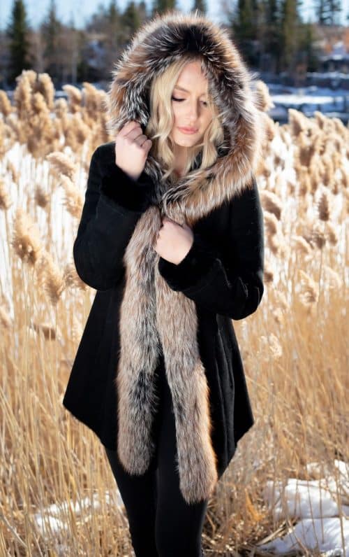 woman wearing a hooded Marsala suede shearling with Crystal fox 31”