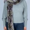 purple and gray long scarf over her shoulder