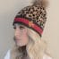 EMBROIDER ANIMAL PRINT HAT WITH FOX POM
