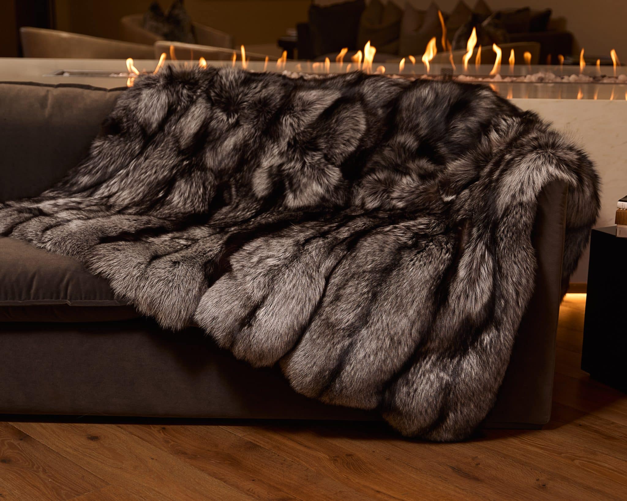 Silver Fox Blanket draped over couch