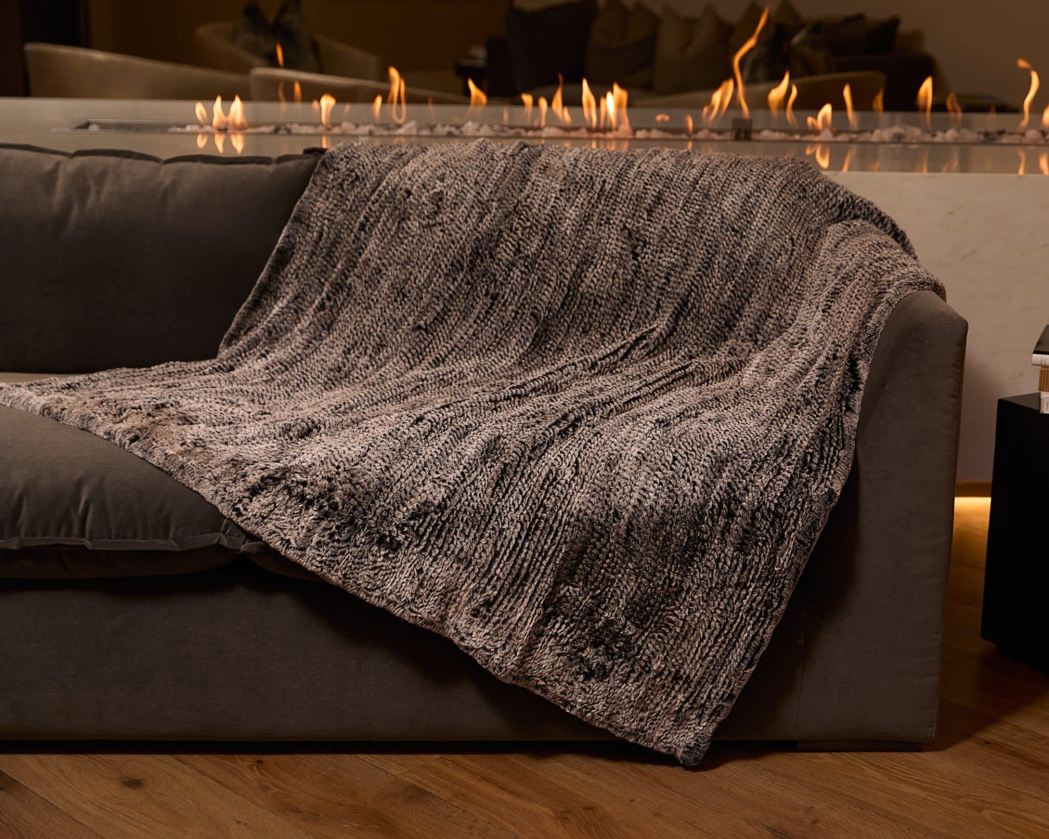 Knitted Chinchilla Rex Blanket - Grey - Draped over couch