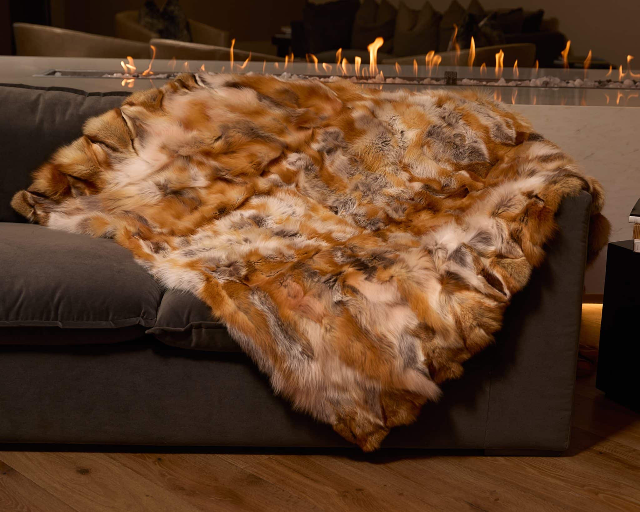 Sculpted Red Fox Blanket draped over couch