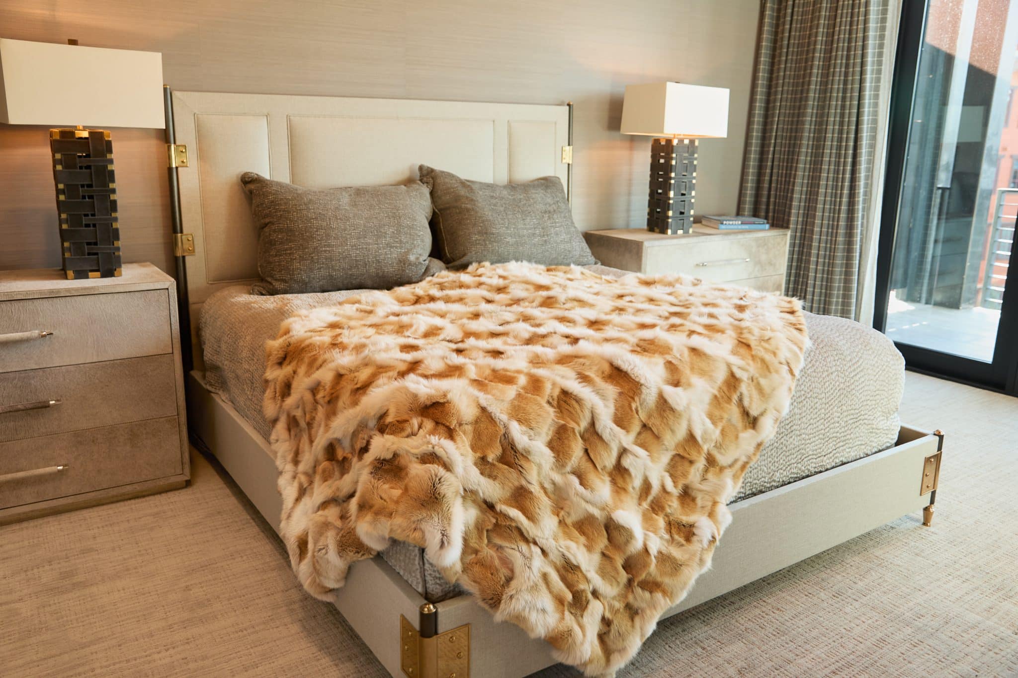 Sculpted Coyote Blanket draped over bed