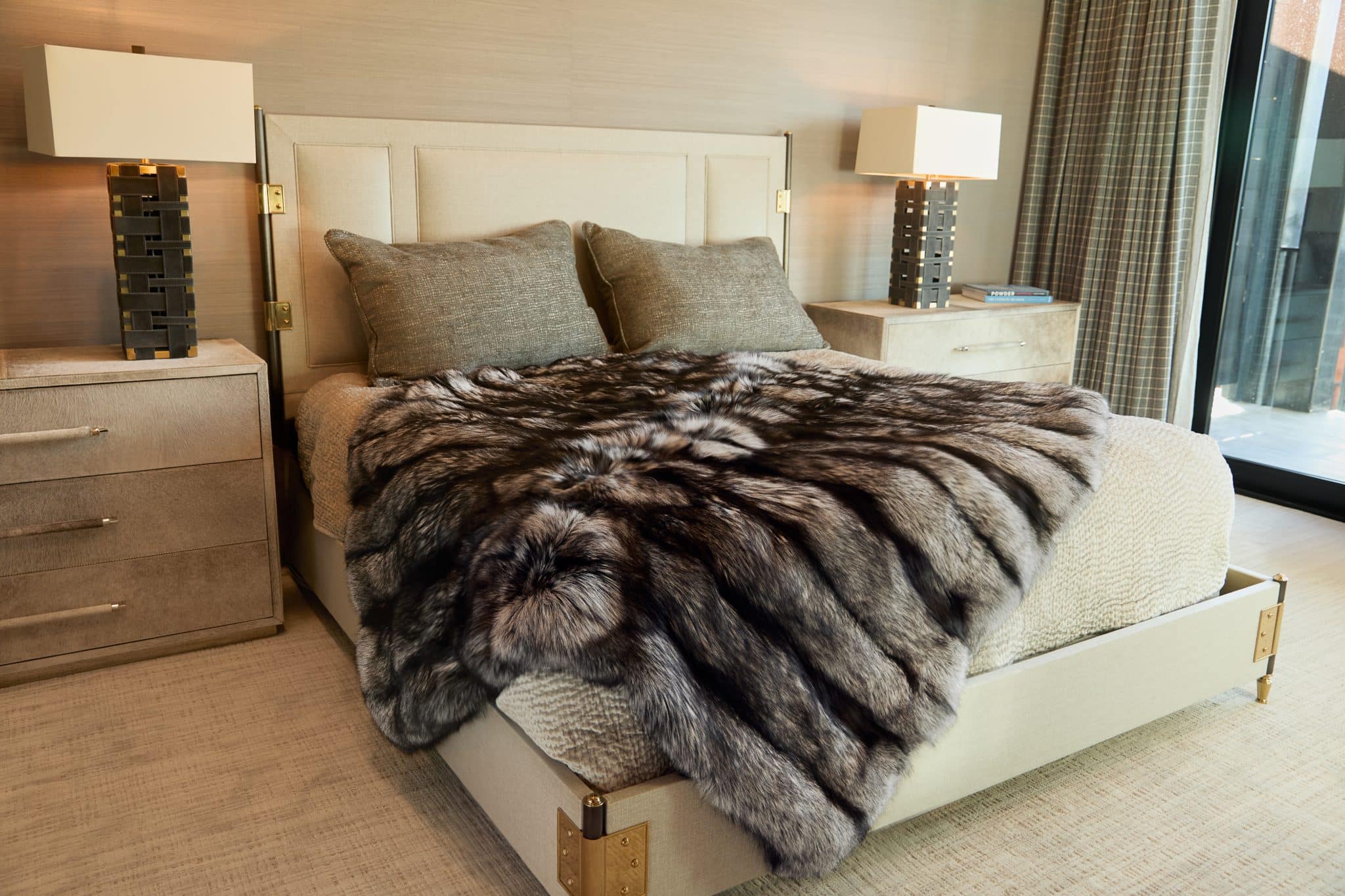 Silver Fox Blanket draped over bed