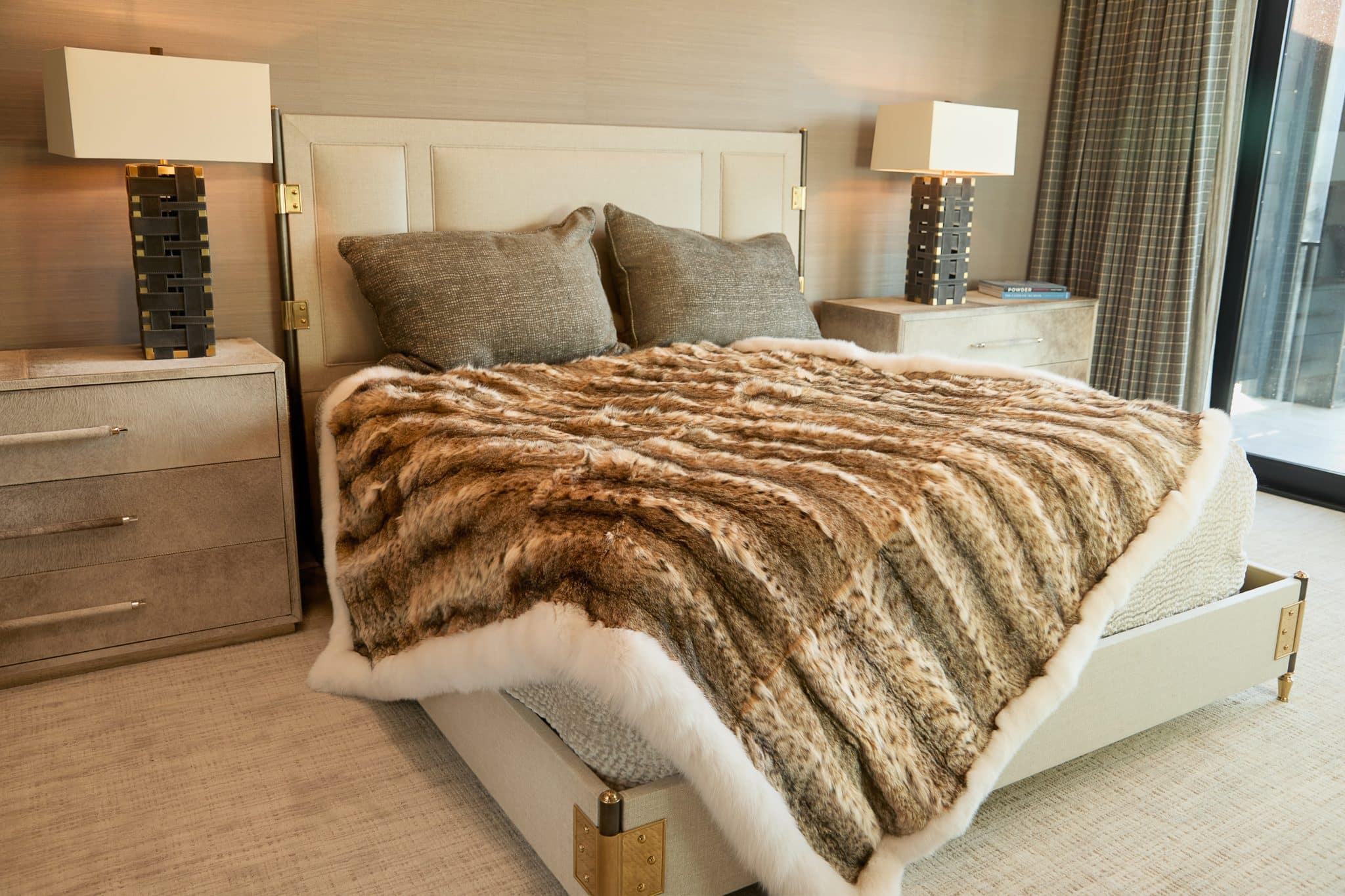 American Lynx with Shadow Fox Trim blanket draped over bed