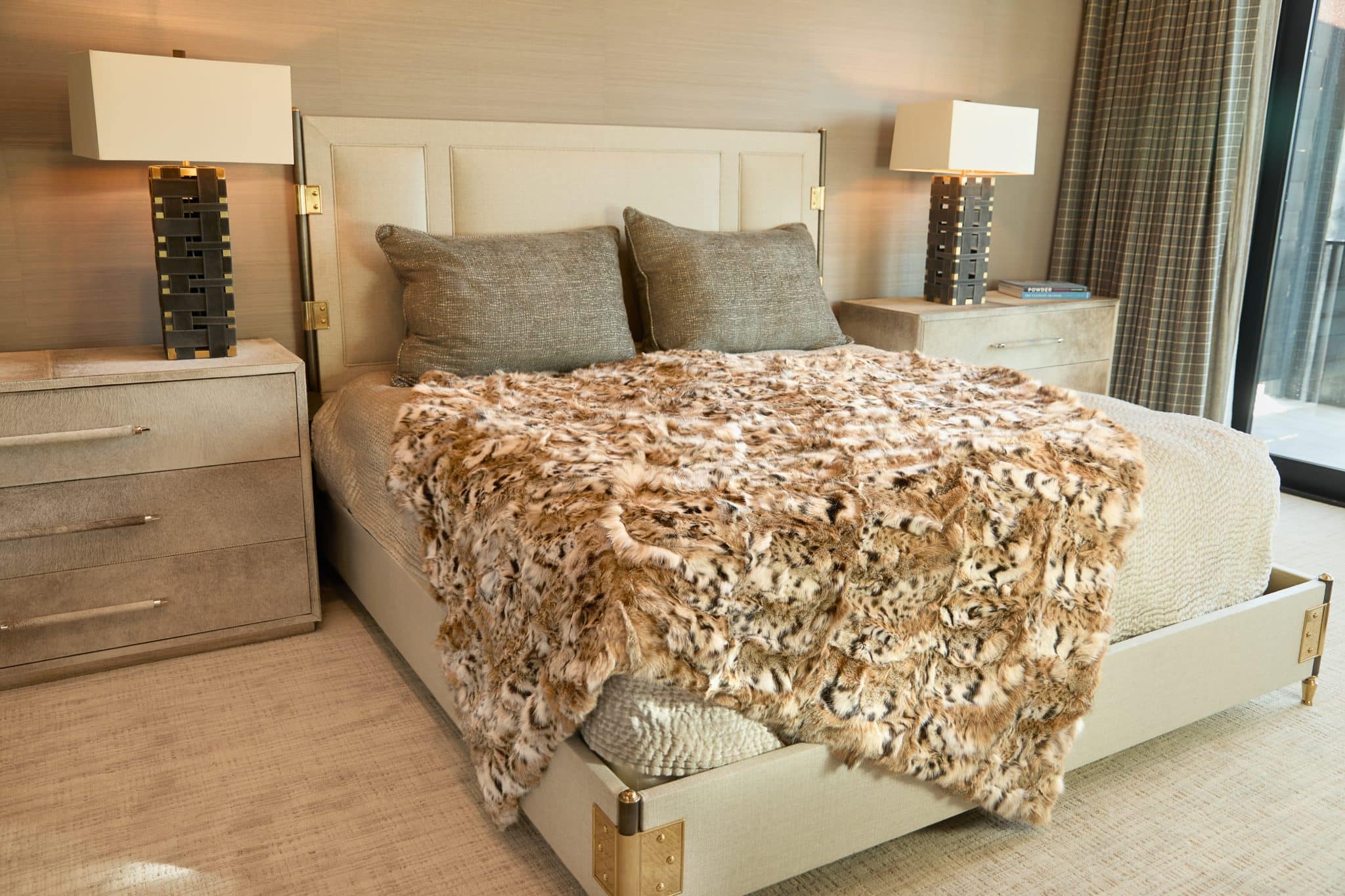 Sculpted American Lynx Blanket draped over bed