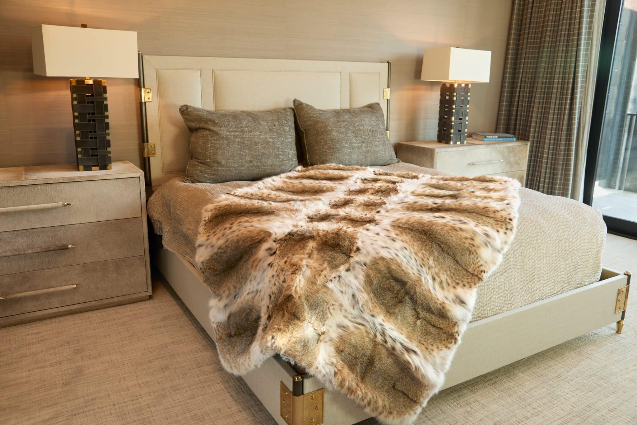 SFG BLANKETS 20243340 American Lynx Blanket draped over bed