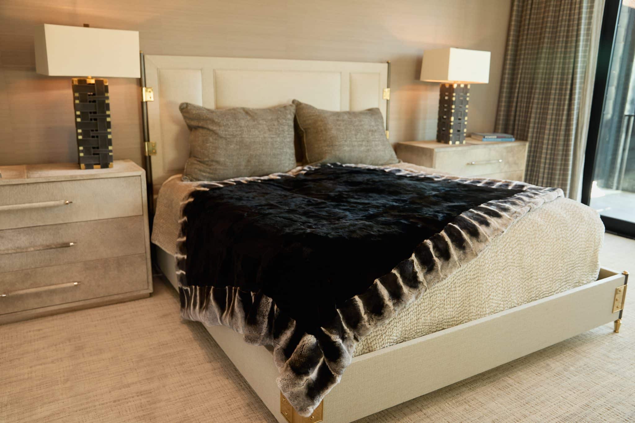 Onyx Chinchilla Rex Blanket draped over bed