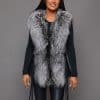 SFGPHOTOPIADAY1_LOOK40_0103 Frontal view of a woman in a silver fox pelt vest standing in front of a grey background