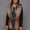 SFGPHOTOPIADAY1_LOOK40_0105 Frontal view of a woman in a crystal fox pelt vest standing in front of a grey background