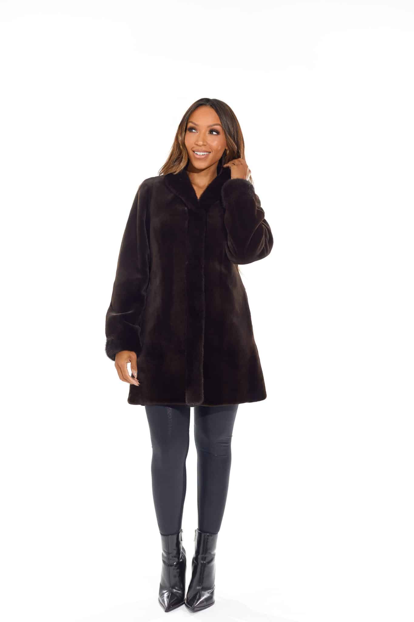 9954Espresso-1 Frontal view of a woman in a black coat with the fur side out standing in front of a white background