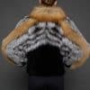 CAMILLA RED FOX JACKET BACK the back of a woman in a red and black jacket with her hands on her waist against a grey background