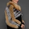 CAMILLA RED FOX JACKET SIDE side of a woman in a red and black jacket against a grey background