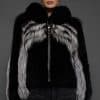 CAMILLA SILVER FOX JACKET FRONT woman in a silver and black jacket against a grey background