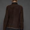 IMANI BROWN TAN JACKET BACK the back of woman in a dark brown jacket against a grey background