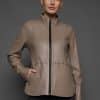 IMANI BROWN TAN JACKET REV FRONT woman in a light brown leather jacket against a grey background