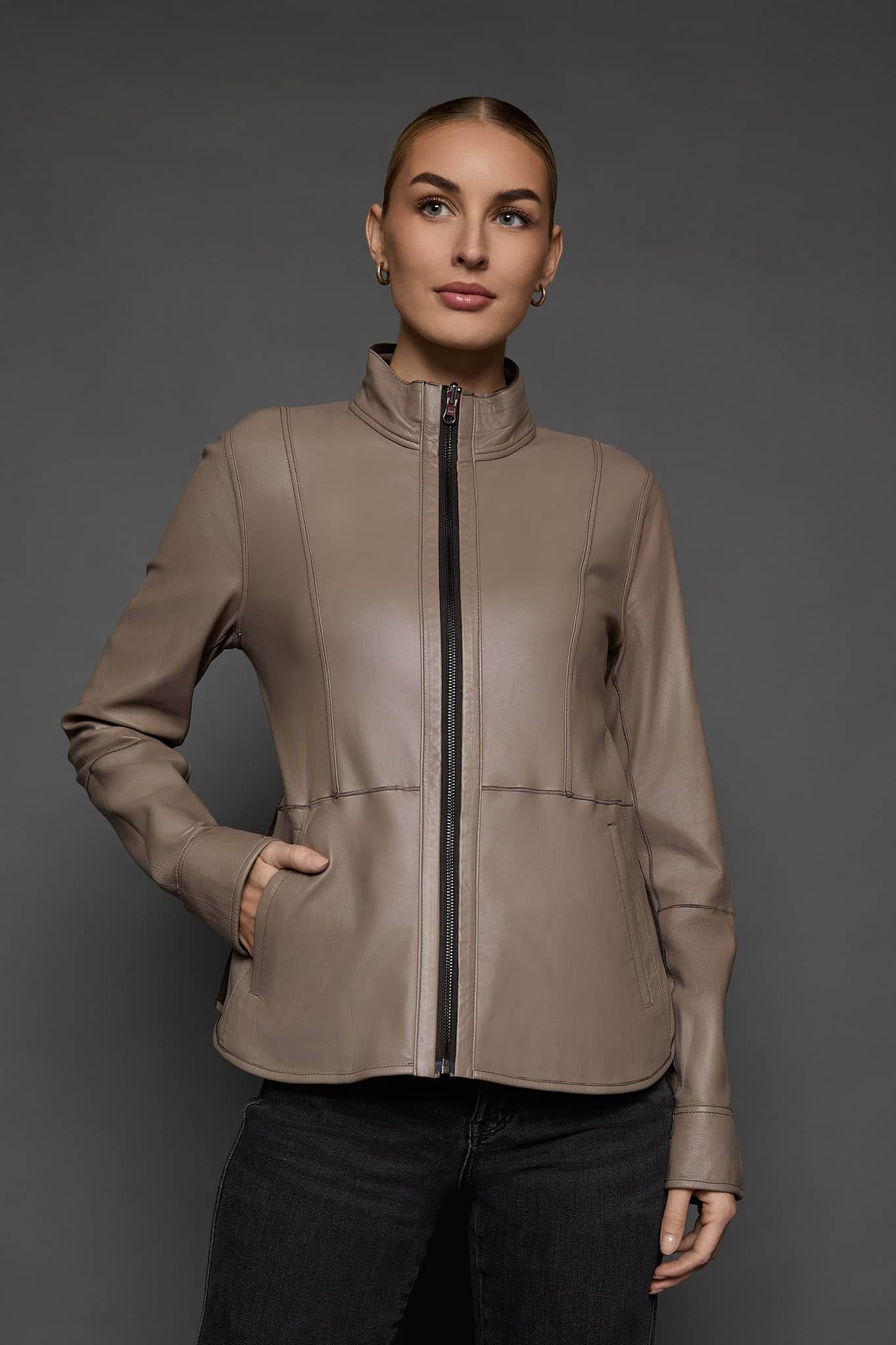 IMANI BROWN TAN JACKET REV FRONT woman in a light brown leather jacket against a grey background