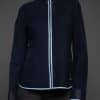 IMANI NAVY BLUE JACKET DETAILS bodice shot of a woman in a dark blue jacket against a grey background