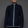 IMANI NAVY BLUE JACKET FRONT woman in a dark blue jacket against a grey background