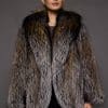 woman in a brown fur coat against a grey background