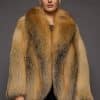 a woman in a red fur coat against a grey background
