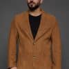 man in a tan coat against a grey background