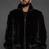 MENS JULIAN MINK JACKET BLACK FRONT man in a black jacket against a grey background