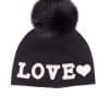Beanie Black Love A black beanie with the word "love" embroidered on it and a fox fur pom pom on it atop a white background.