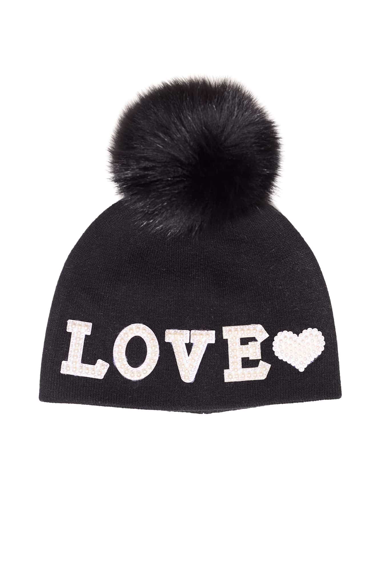 Beanie Black Love A black beanie with the word "love" embroidered on it and a fox fur pom pom on it atop a white background.