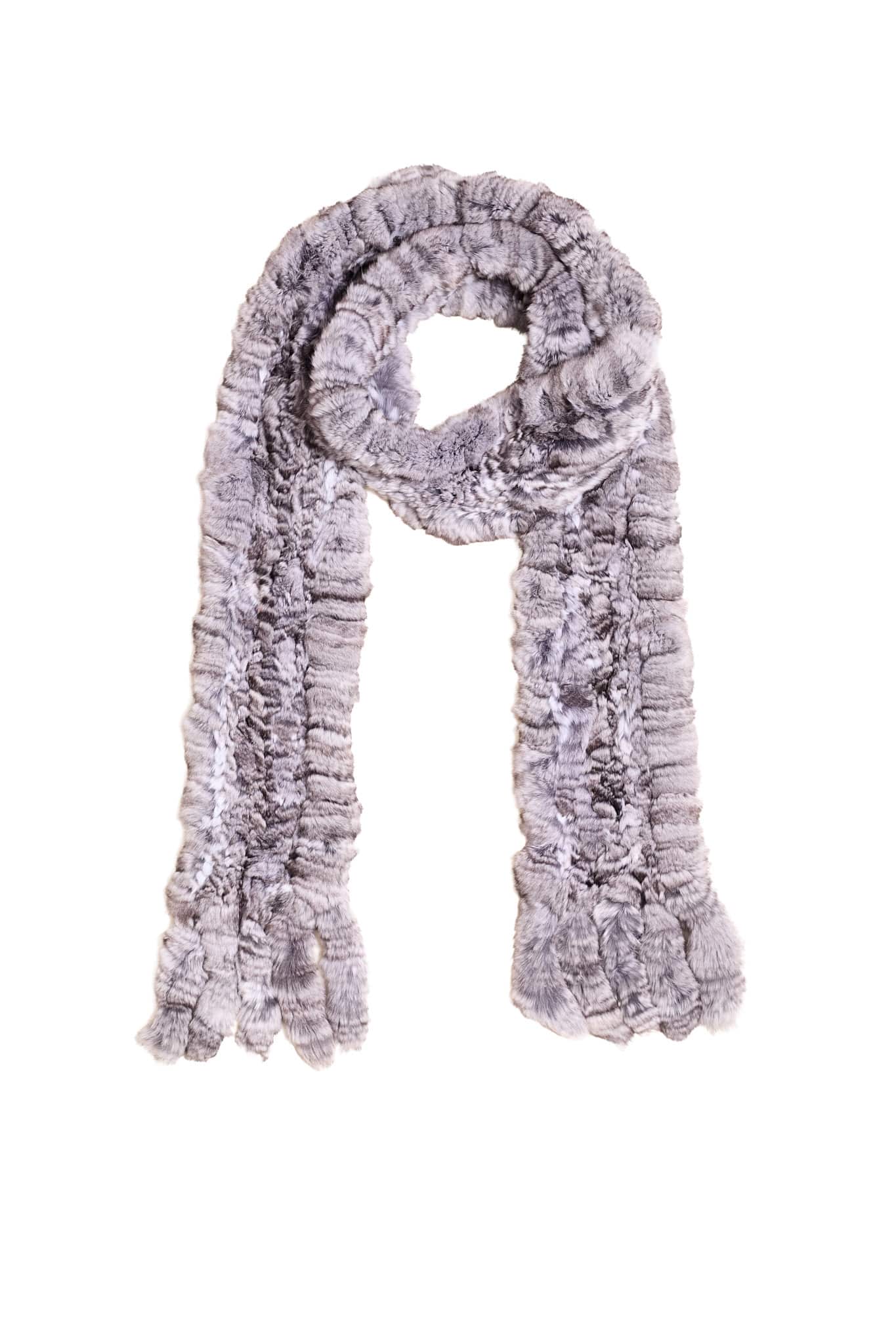 A knit chinchilla fur scarf arranged atop a white background.
