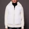 woman in a white jacket against a grey background