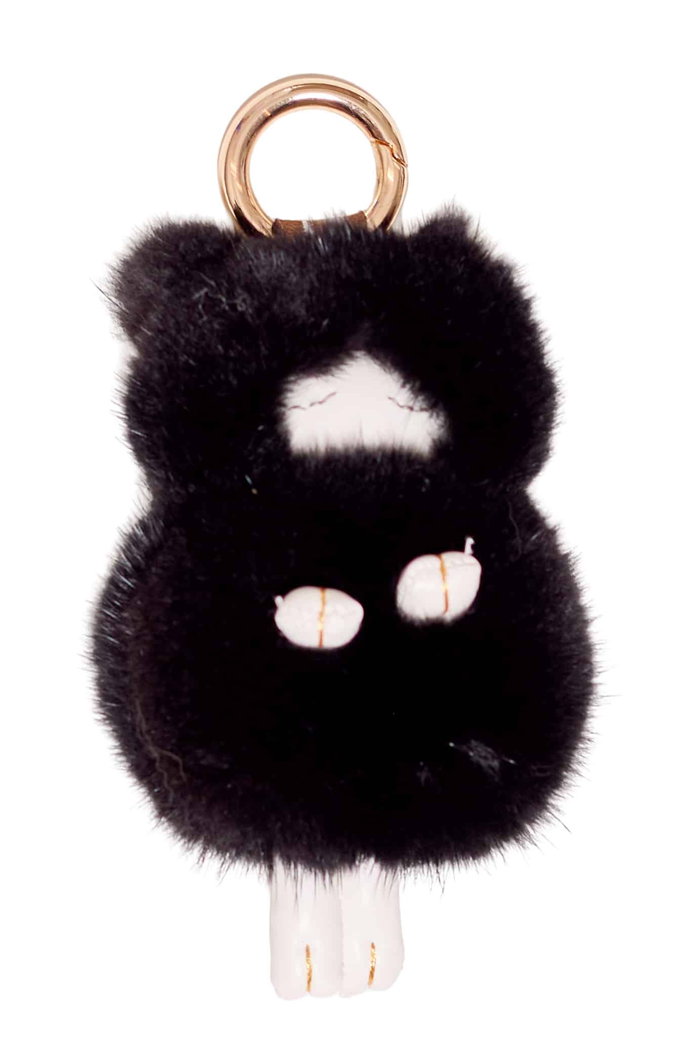 Black colored mink sheep keychain arranged atop a white background.