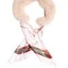 A blush colored fox collar with removable silk scarf inserted inside of it arranged on top of a white background.