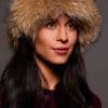 Frontal portrait shot of a woman wearing a tankuki colored fox fur headband.