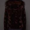 GIA MINK ESPRESSO SILVER FOX BACK the back of a woman in a brown fur jacket against a grey background