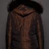 GIA MINK ESPRESSO SILVER FOX REVERSED BACK the back of a woman in a brown fur jacket against a grey background