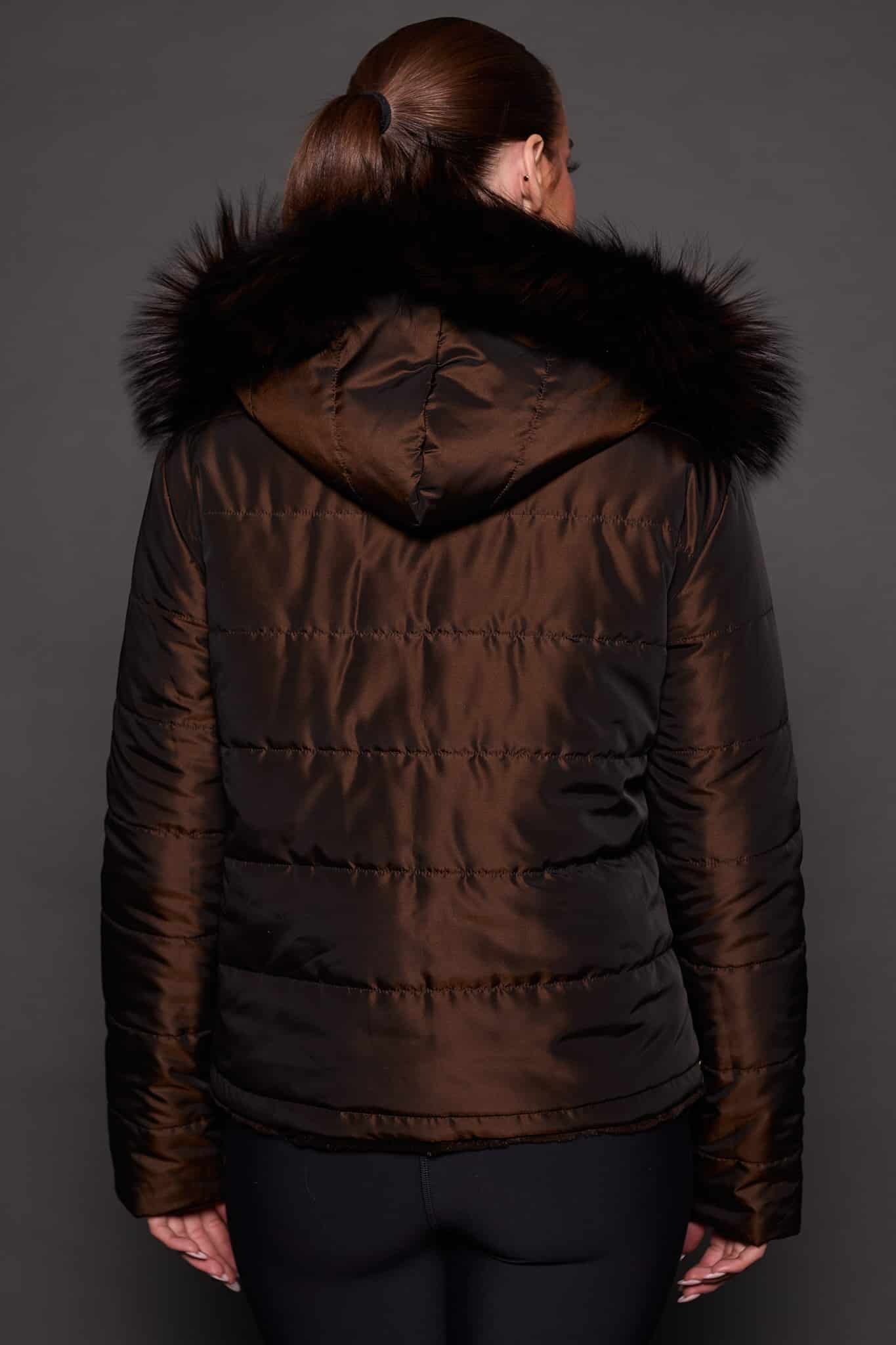 GIA MINK ESPRESSO SILVER FOX REVERSED BACK the back of a woman in a brown fur jacket against a grey background