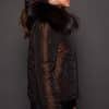 GIA MINK ESPRESSO SILVER FOX REVERSED SIDE the side of a woman in a brown fur jacket against a grey background