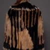 SASCHA REX KNIT BLACK BACK the back of a woman in a black and brown fur knitted jacket against a grey background