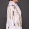 SASCHA REX KNIT WHITE SIDE the side of a woman in a white fur knitted jacket against a grey background